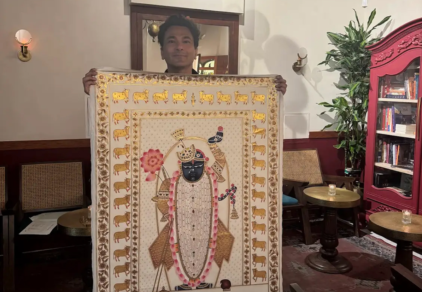 Traditional Pichwai artwork showcasing Shrinathji in a spiritual setting with Chef Vikas Khanna